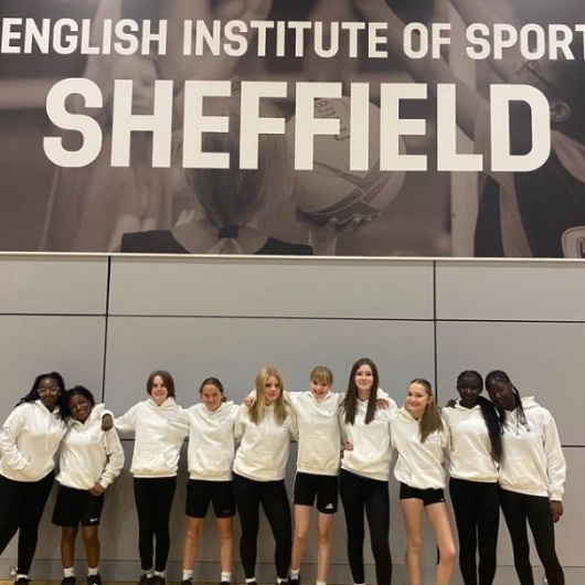 girls pose for a photo after their  sports leadership day at the institute of sport